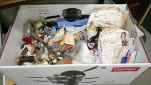 A box of needlework items