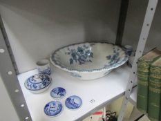 A large blue and white wash basin and other blue and white china