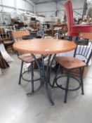 A bar table and 2 stools