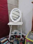 A painted folding chair and a mirror