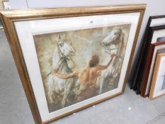 A large gilt framed and glazed print of 2 rearing horses