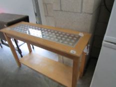 A modern glass topped side table