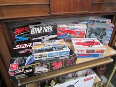 A collection of boxed IMAI Captain Scarlet and Thunderbird model kits together with 2 AMT