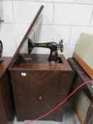 A Singer cabinet sewing machine