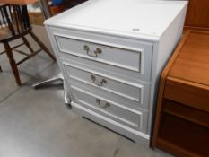 a 3 drawer white chest