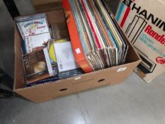 A box of LP records and CD's