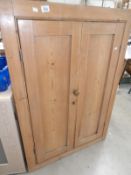 A pine corner cupboard