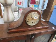 An oak mantel clock