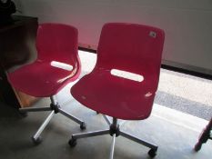 2 pink office chairs