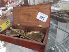 A cased set of old Avery apothecary scales