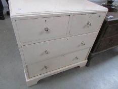 A painted 2 over 2 chest of drawers