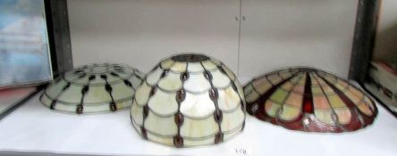 A matching Tiffany style ceiling lamp shade and table lamp shade together with one other ceiling