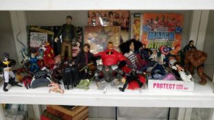 A collection of action figures, toys and cards, wrestling books, Yu gi Oh cards,