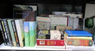 A shelf of assorted books including History,