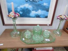 A green glass trinket set