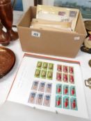 An album of stamps and a box of stamped envelopes