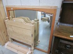 A large pine framed mirror