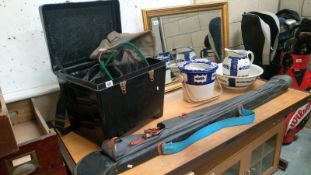 A tackle box/seat and contents including floats, hooks weights and an umbrella , bank sticks,