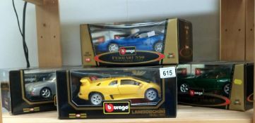 4 boxed large Burago, Ferari, Porsche & Lambourgini models