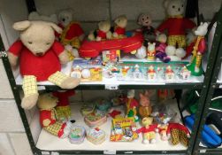 2 shelves of Rupert the Bear memorabilia soft toys,