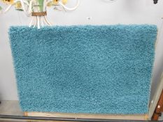 A duck egg blue rug (approximate size 47" x 63")