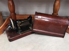 A cased Bradley sewing machine