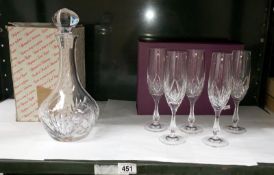 A Nachtmann decanter and 5 Nachtmann champagne flutes