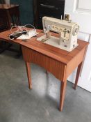 A Singer sewing machine and work table