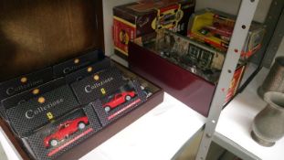 A quantity of boxed model cars including Burago