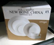 A boxed 20 piece china dinner set