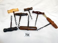 A quantity of old corkscrews including bone handled example