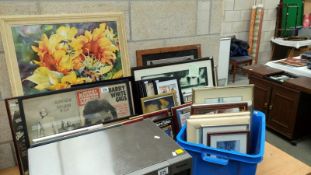 A large quantity of frames with prints,