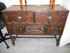 A small carved oak sideboard