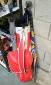 A good set of golf clubs in bag & 2 umbrellas