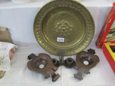 A pair of arts and crafts candleholders and a brass plaque