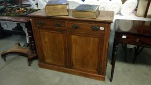 A mahogany 2 door 2 drawer cabinet