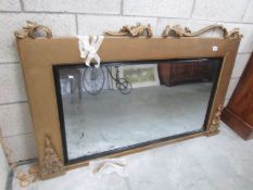 A large gilt framed overmantel mirror