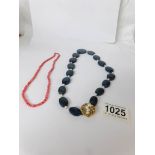A good 'Blue John' stone necklace with 14kt gold and pearl set clasp together with a coral necklace