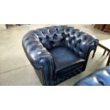 A blue leather Chesterfield style arm chair