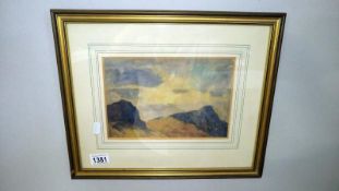 A framed and glazed mountain scene