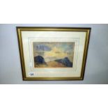 A framed and glazed mountain scene