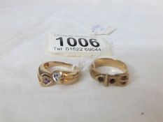 A 9ct gold buckle ring and a 9ct gold cross over ring,