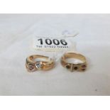 A 9ct gold buckle ring and a 9ct gold cross over ring,