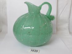 A French art deco vaseline glass jug marked Schieder