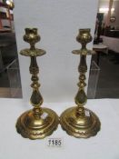 A pair of Victorian brass candlesticks