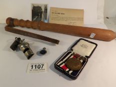 A collection of police memorabilia including trucheon, 2 whistles, photograph,