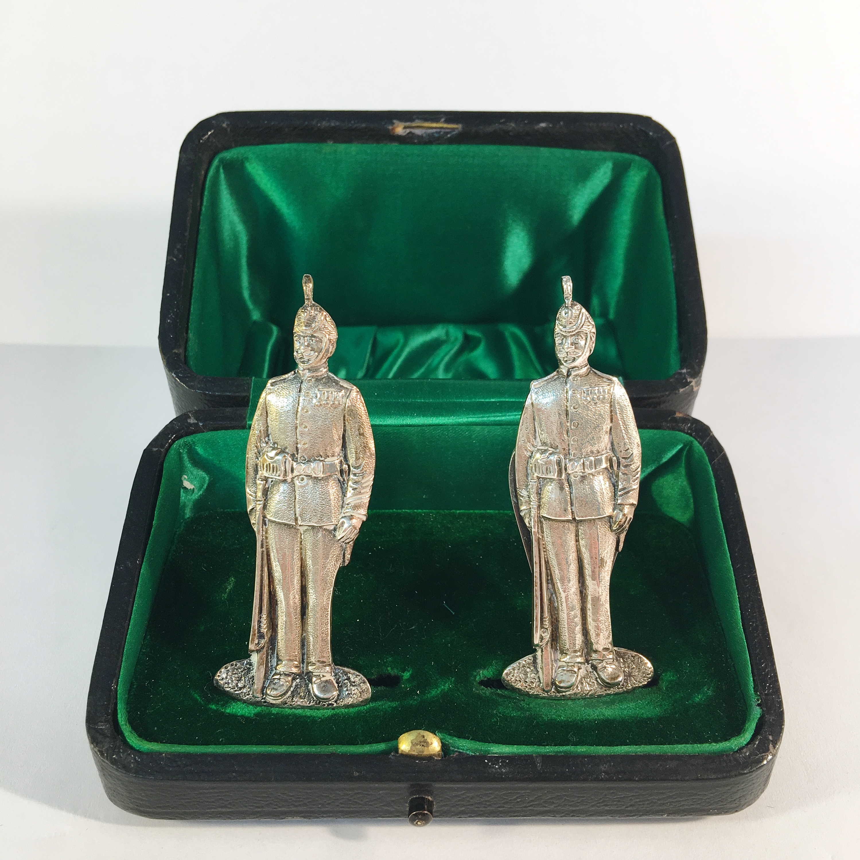 A fine cased pair of silver military menu stands, hall marked London 1908, 39.