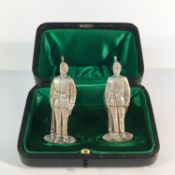 A fine cased pair of silver military menu stands, hall marked London 1908, 39.