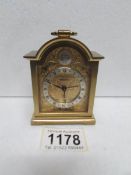 A Swiza Tempus Fugit brass carriage clock