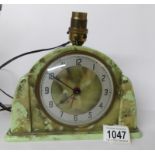 An Art Deco green bakelite Metamec electric clock/lamp